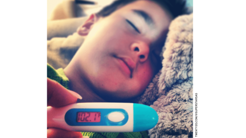 Child in bed with fever